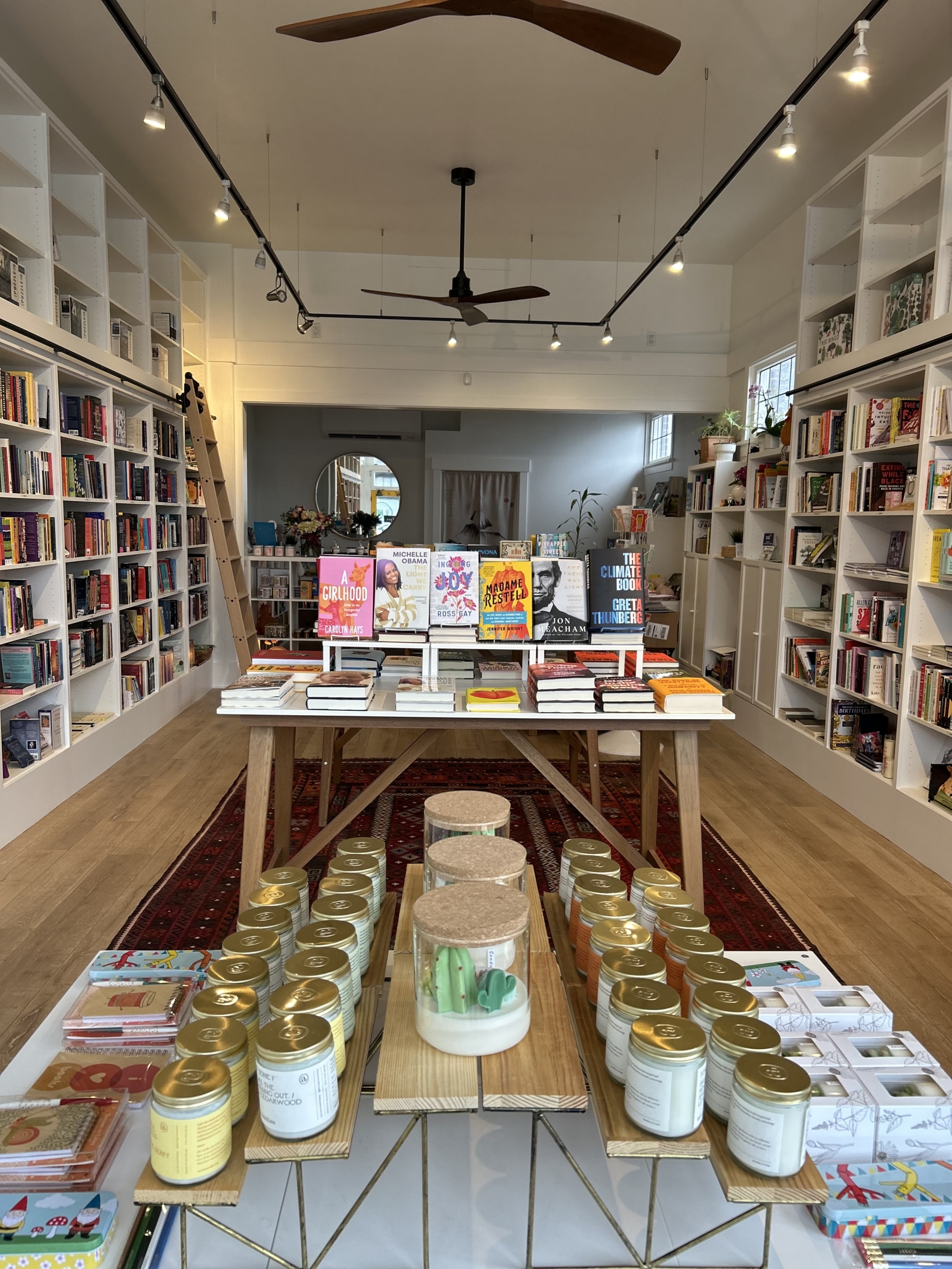 Three Trees Books interior with table of candles and gifts