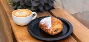 Pastry and coffee served at bakery