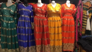 photo of four East African dresses, also called Habesha kemis, at Azmera Market & Fashion in Seattle.