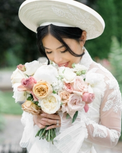 Photo of bride with bouquet of flowers from Emerald City Flowers