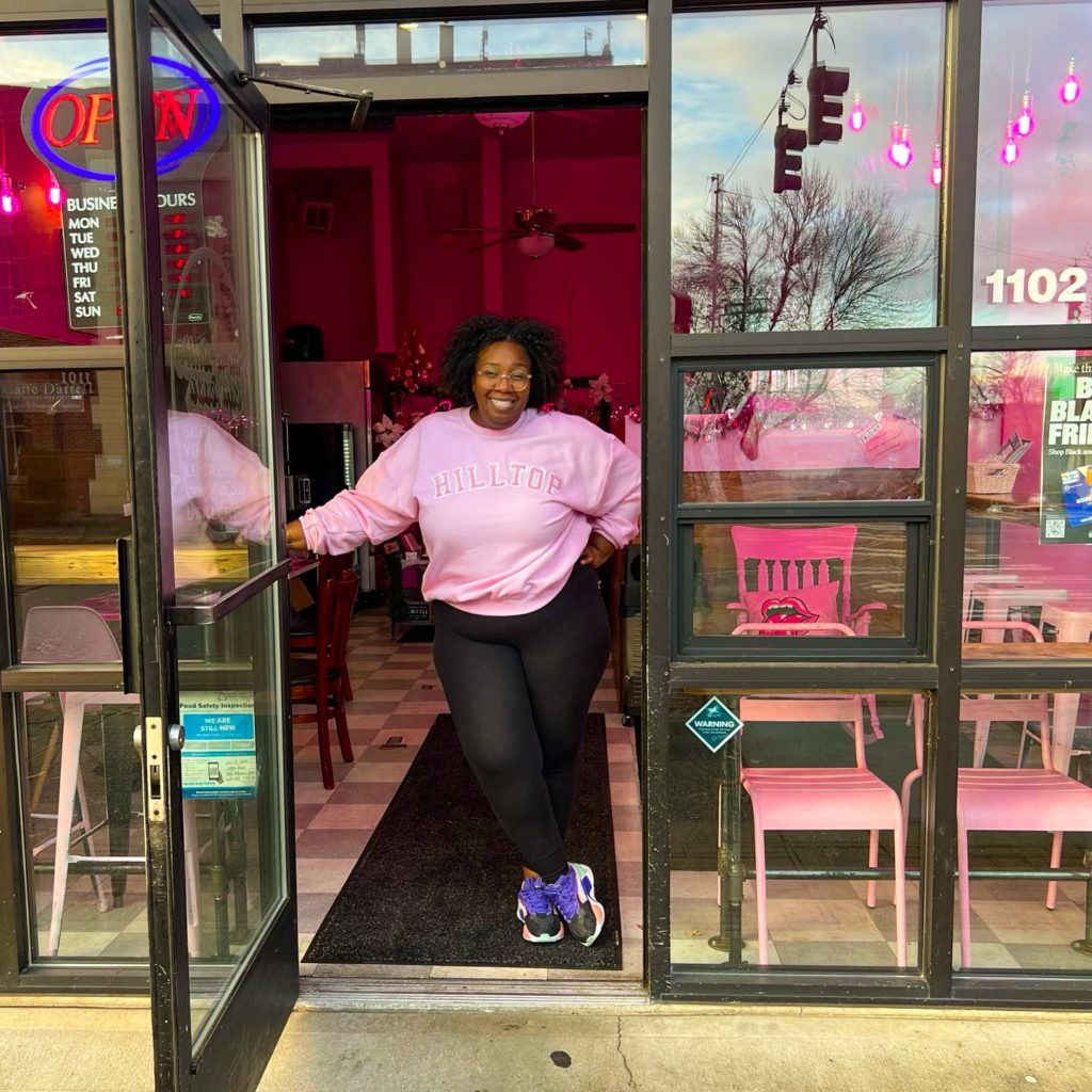 Luv-a-Latte owner Aundrea McCarthy posing inside the doorway of her cafe