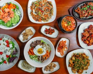 Seoul Tofu & Jjim spread of Korean dishes photo credit Uber Eats